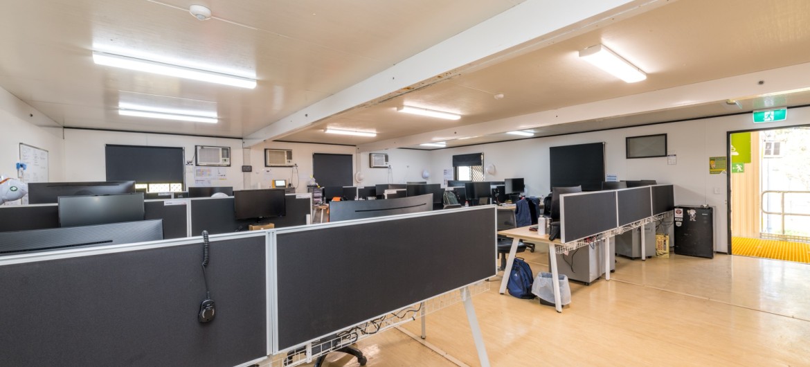 An internal view of one of the John Holland offices within the site building showing the desks and computers